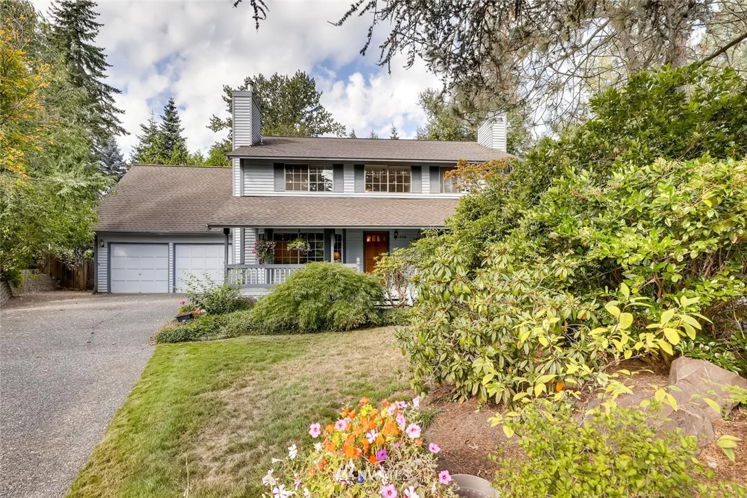 1908 233rd Place Southeast Bothell, WA 98021 - Photo 2 of 24 a front view of a house with a garden