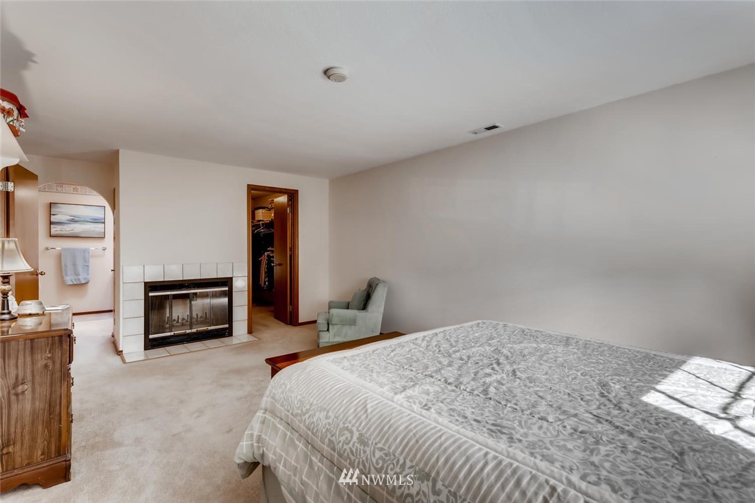 1908 233rd Place Southeast Bothell, WA 98021 - Photo 11 of 24 a bedroom with a bed and a fireplace