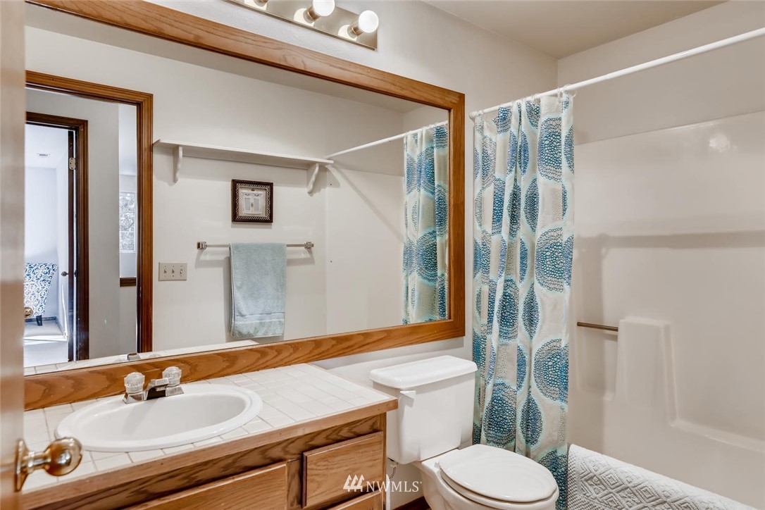 1908 233rd Place Southeast Bothell, WA 98021 - Photo 16 of 24 a bathroom with a sink toilet and shower