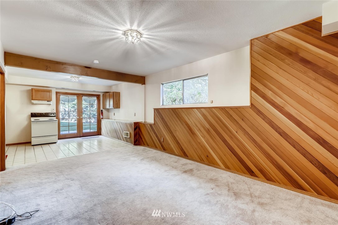 1908 233rd Place Southeast Bothell, WA 98021 - Photo 17 of 24 a view of a bedroom with wooden floor and a ceiling fan