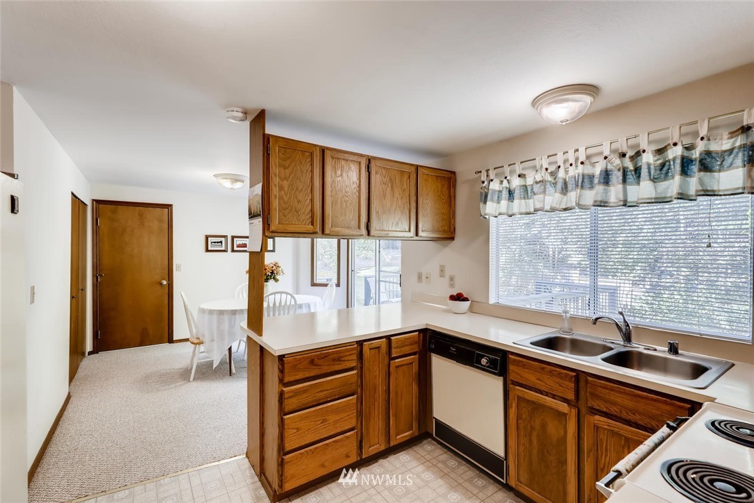 1908 233rd Place Southeast Bothell, WA 98021 - Photo 7 of 24 a kitchen with a sink and cabinets