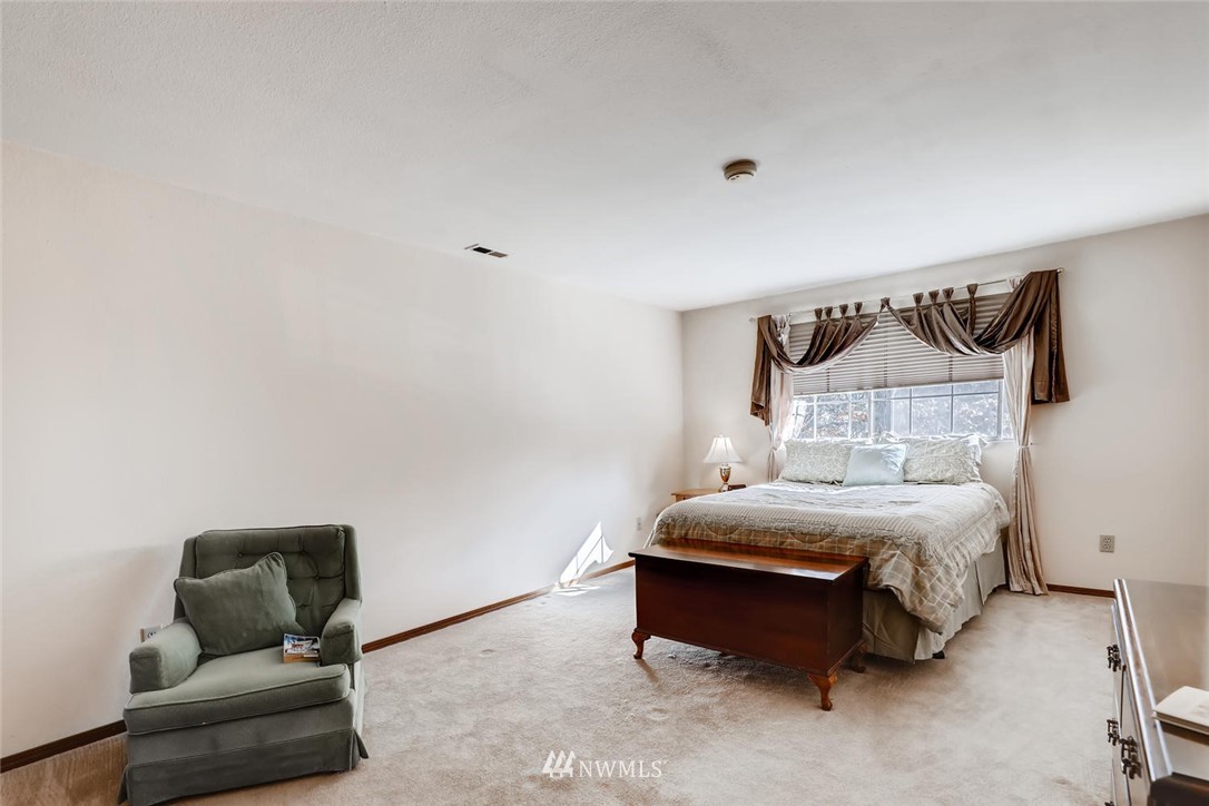 1908 233rd Place Southeast Bothell, WA 98021 - Photo 10 of 24 a bedroom with a bed and couch
