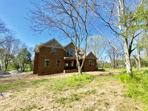 12705 North Milton Road Milton, TN 37118 - Photo 6 of 7 a view of a large house with a yard
