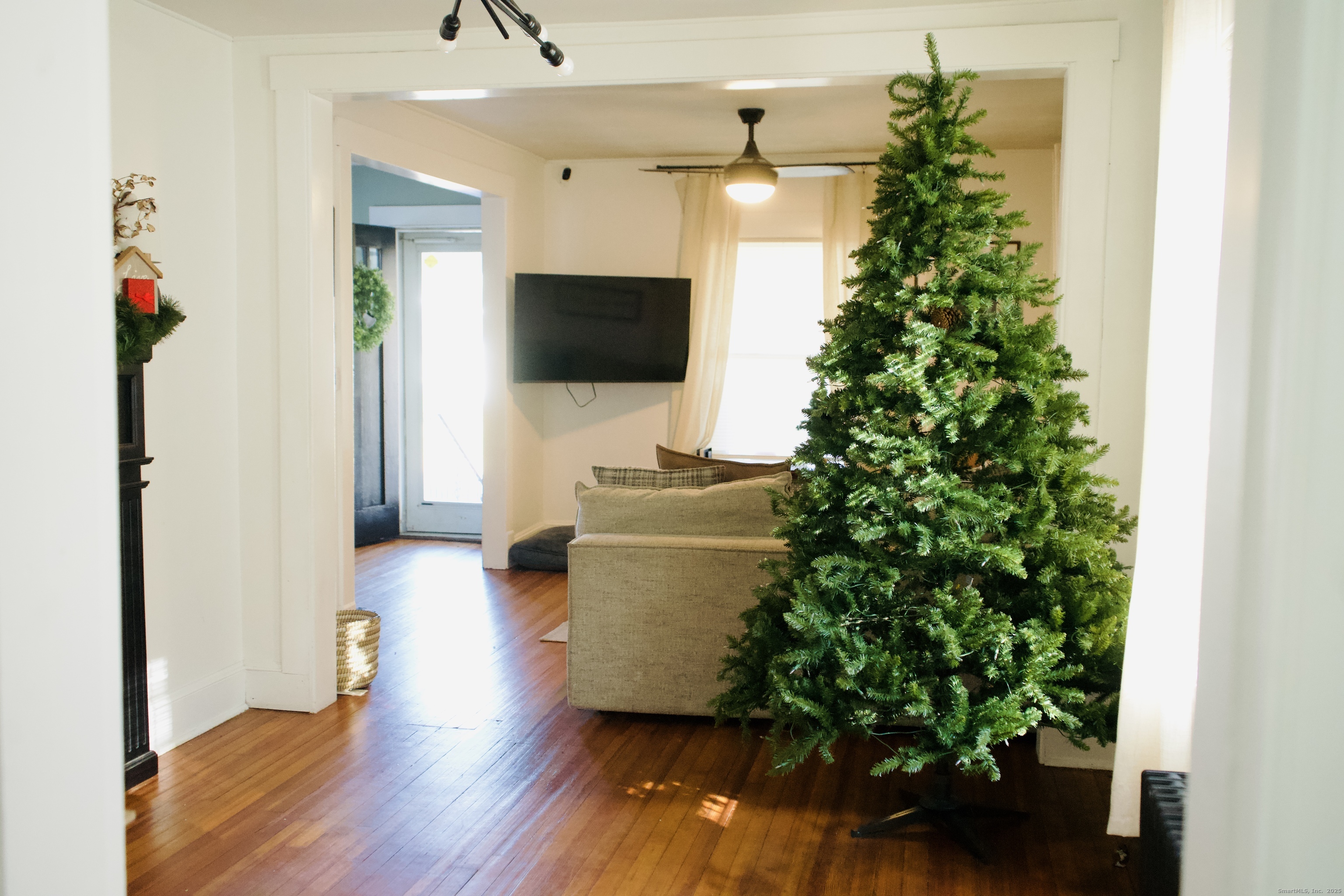 66 North Hoadley Street Naugatuck, CT 06770 - Photo 16 of 22 a living room with furniture and a flat screen tv