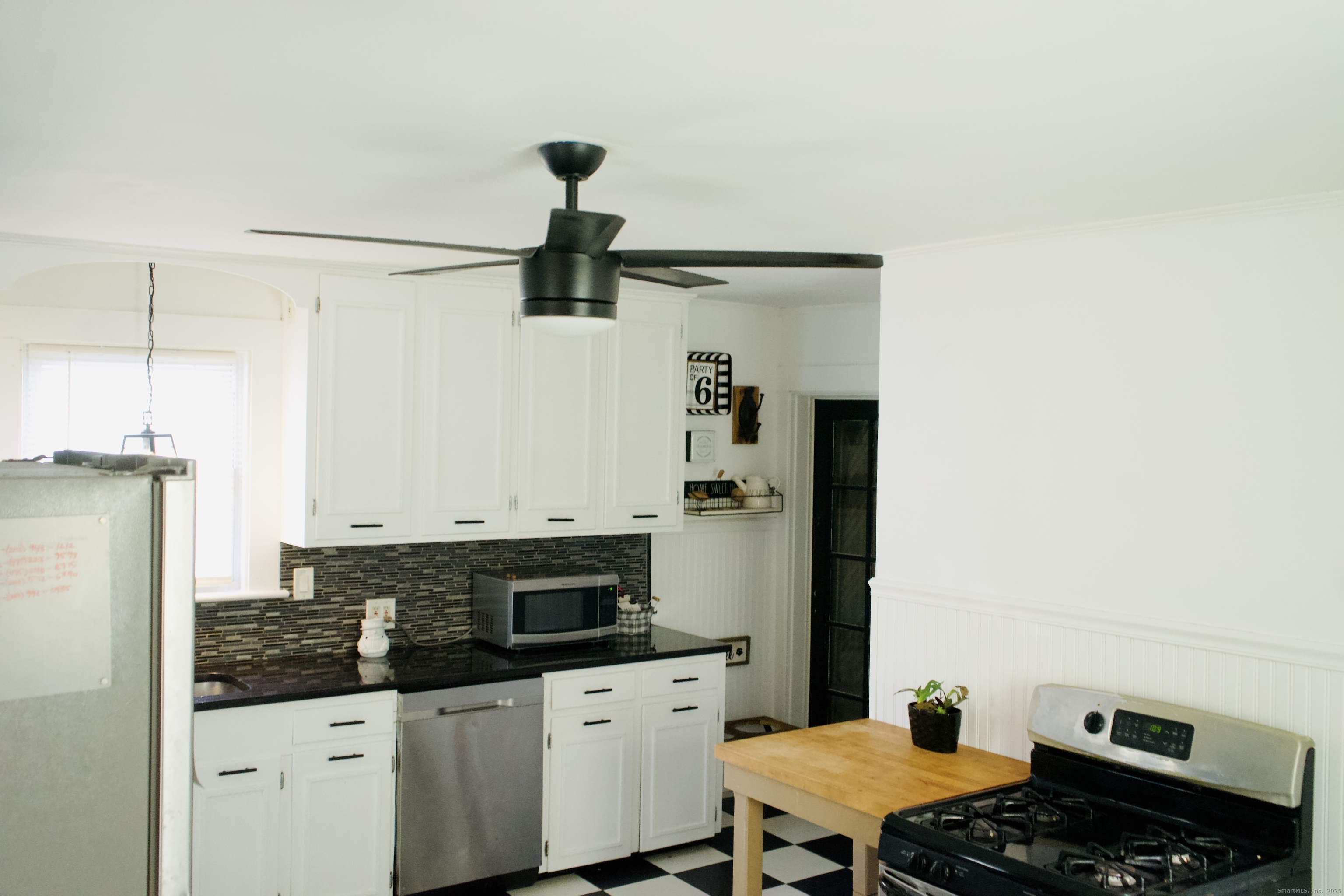 66 North Hoadley Street Naugatuck, CT 06770 - Photo 18 of 22 a kitchen with stainless steel appliances a stove and a refrigerator