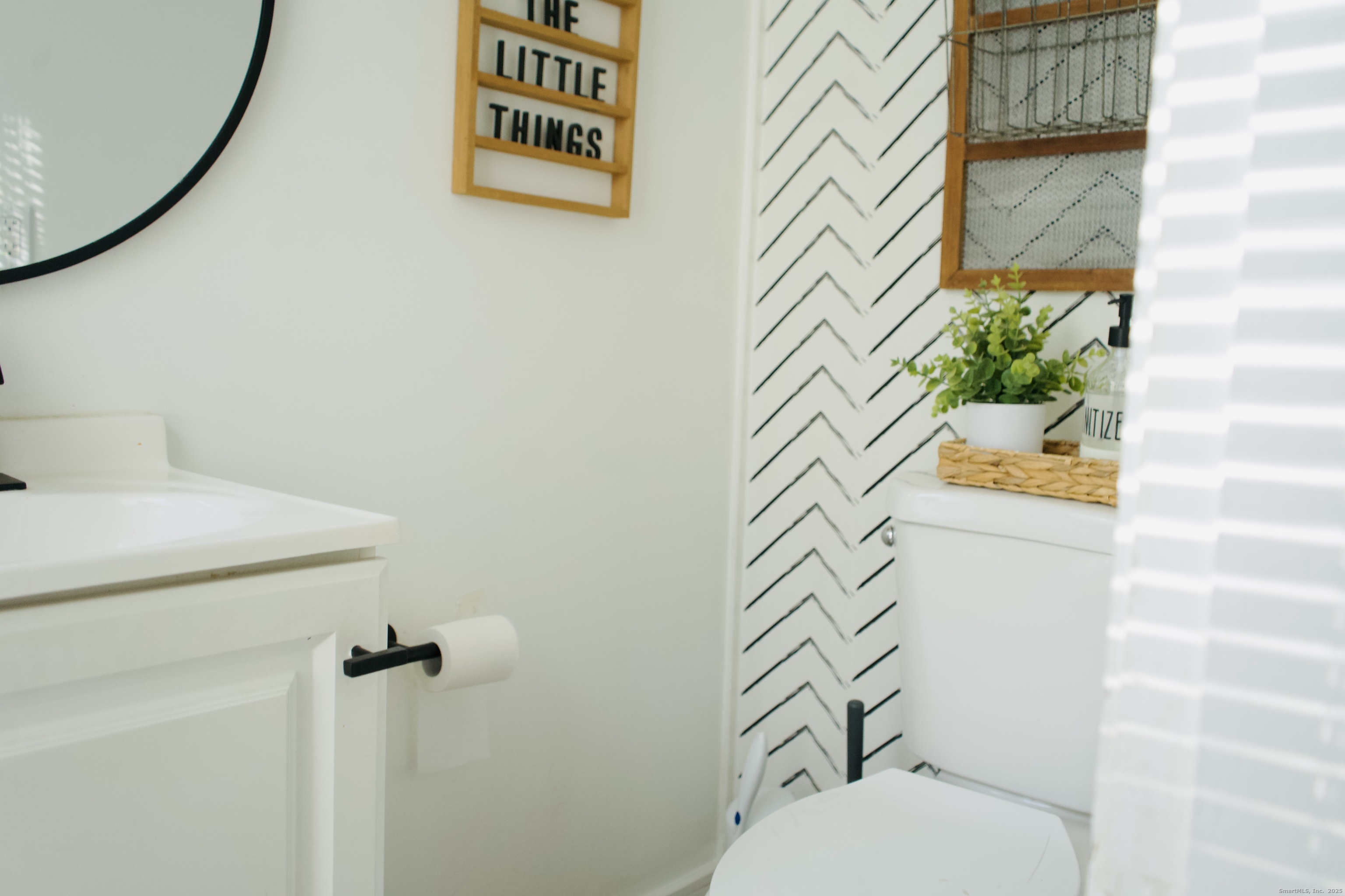 66 North Hoadley Street Naugatuck, CT 06770 - Photo 20 of 22 a bathroom with a toilet and a shower curtain