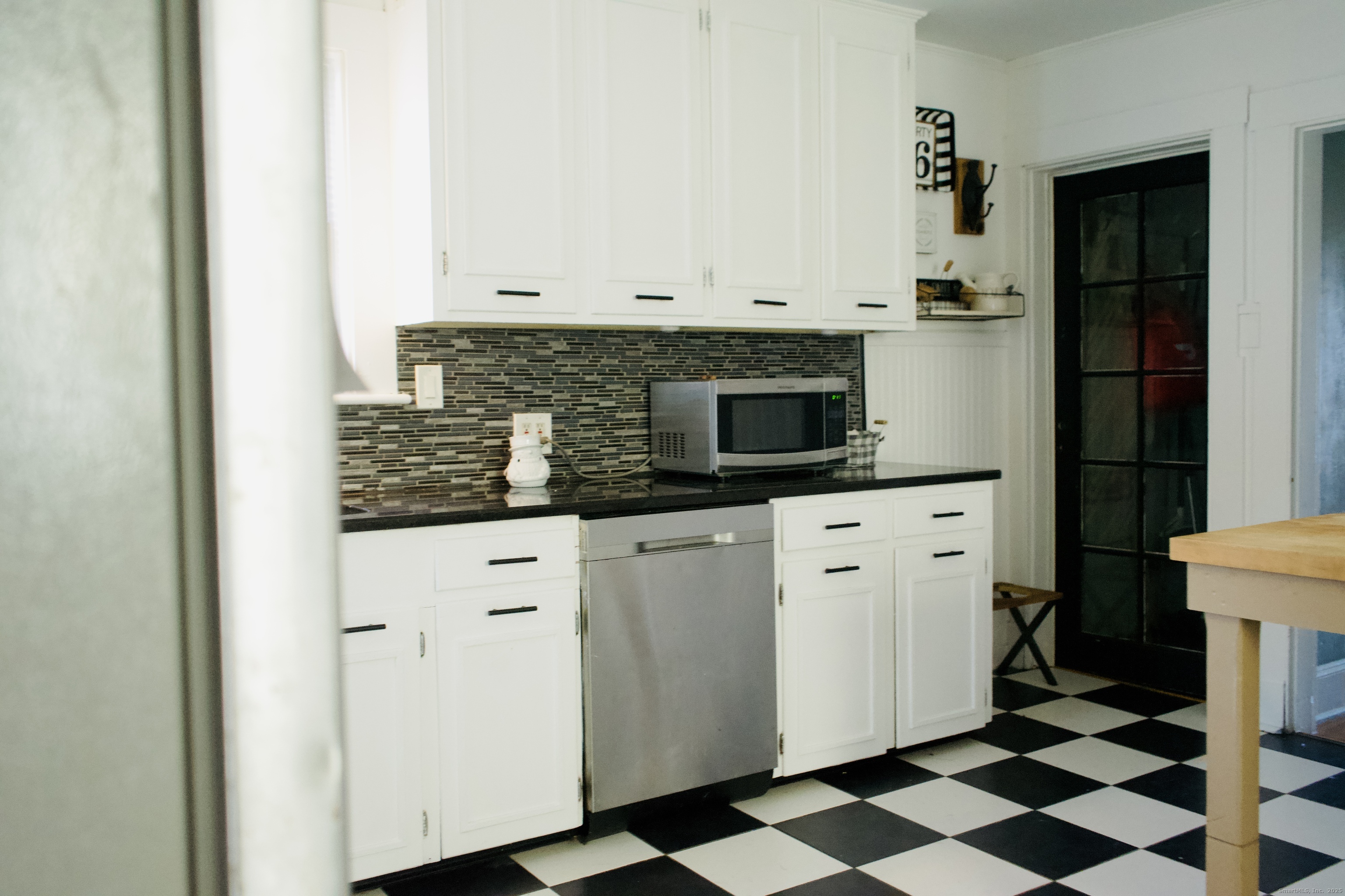 66 North Hoadley Street Naugatuck, CT 06770 - Photo 22 of 22 a kitchen with stainless steel appliances white cabinets and sink