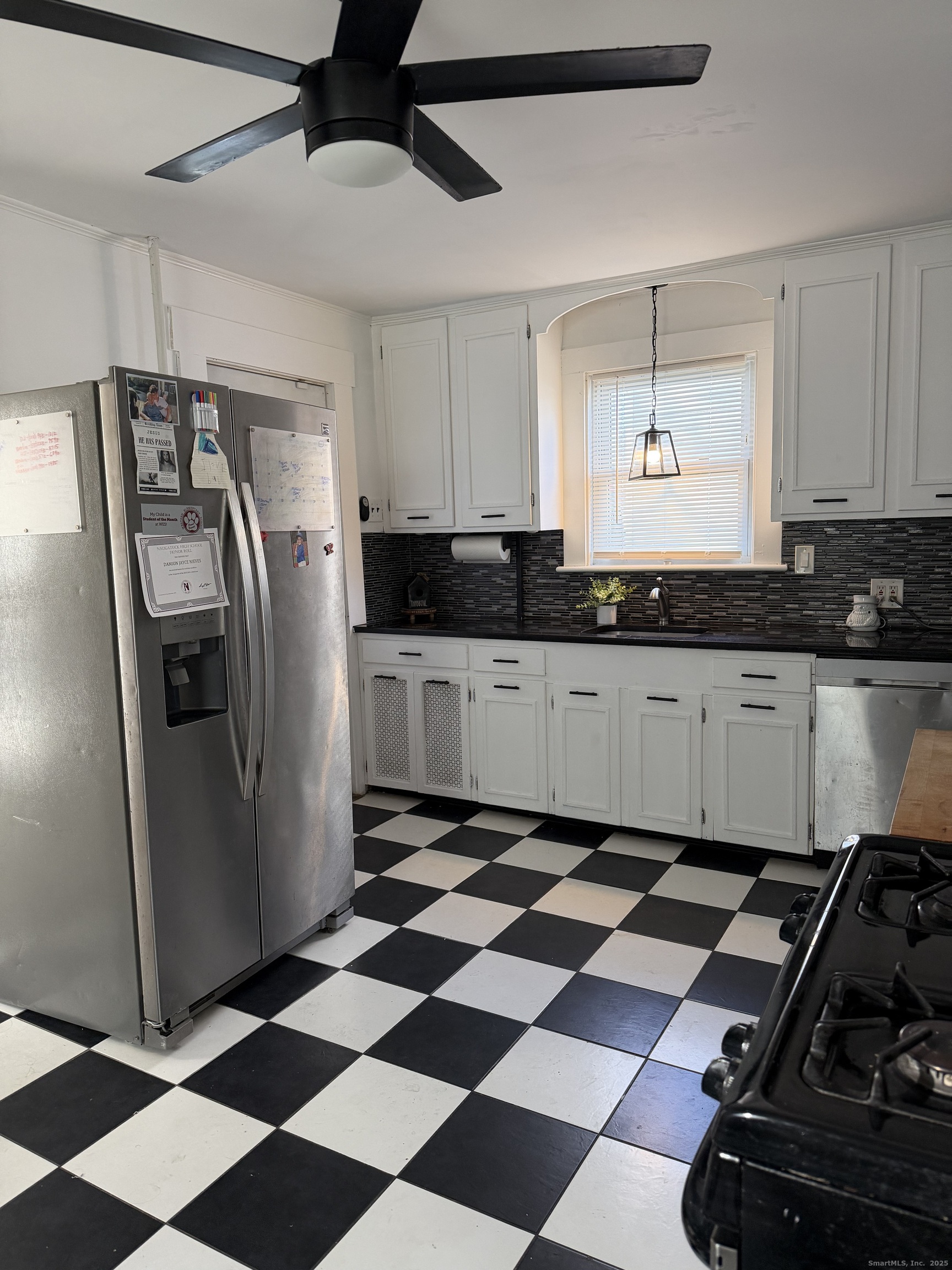 66 North Hoadley Street Naugatuck, CT 06770 - Photo 6 of 22 a kitchen with stainless steel appliances granite countertop a sink a refrigerator and cabinets