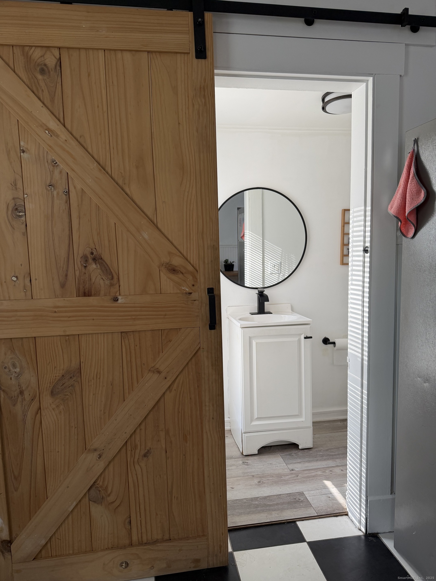 66 North Hoadley Street Naugatuck, CT 06770 - Photo 7 of 22 a bathroom with a sink and mirror