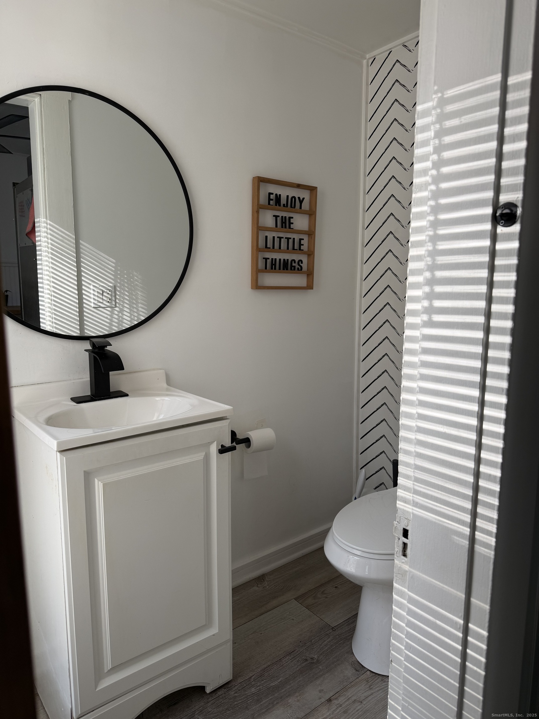 66 North Hoadley Street Naugatuck, CT 06770 - Photo 8 of 22 a bathroom with a toilet and a mirror