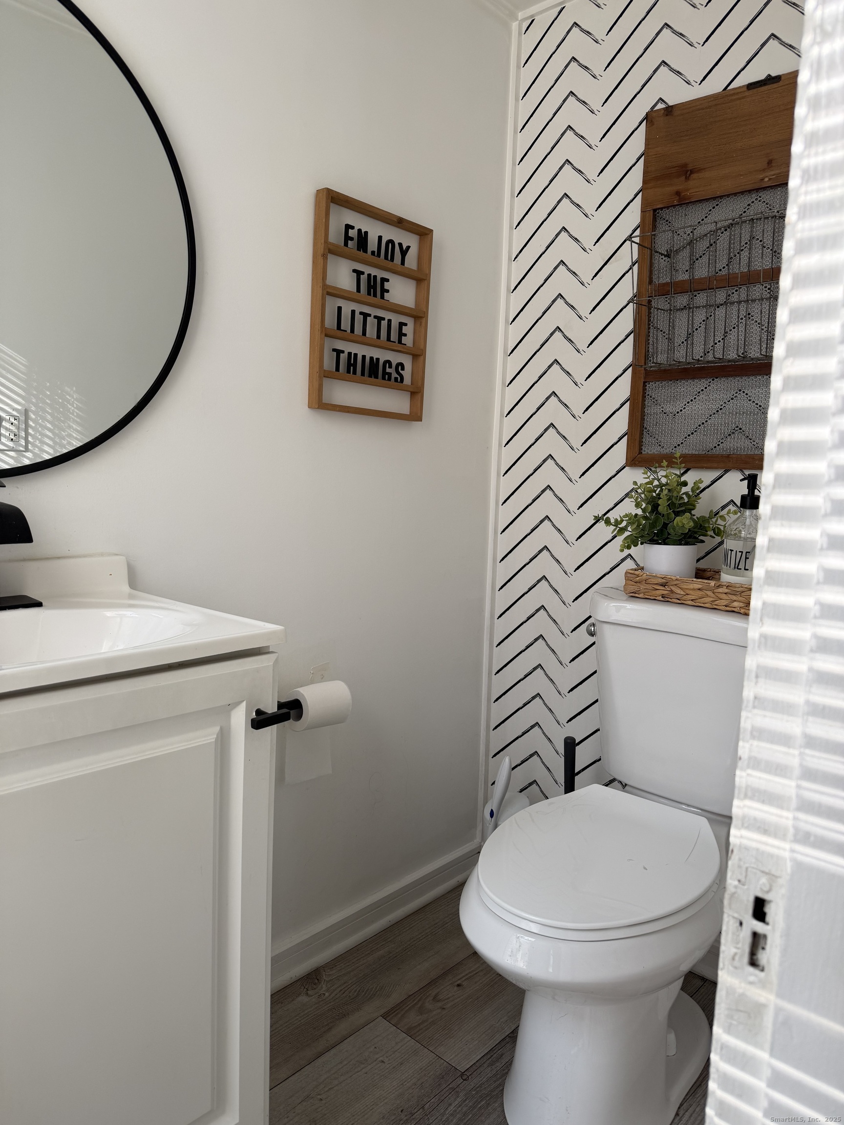 66 North Hoadley Street Naugatuck, CT 06770 - Photo 9 of 22 a white toilet sitting next to a small bathroom