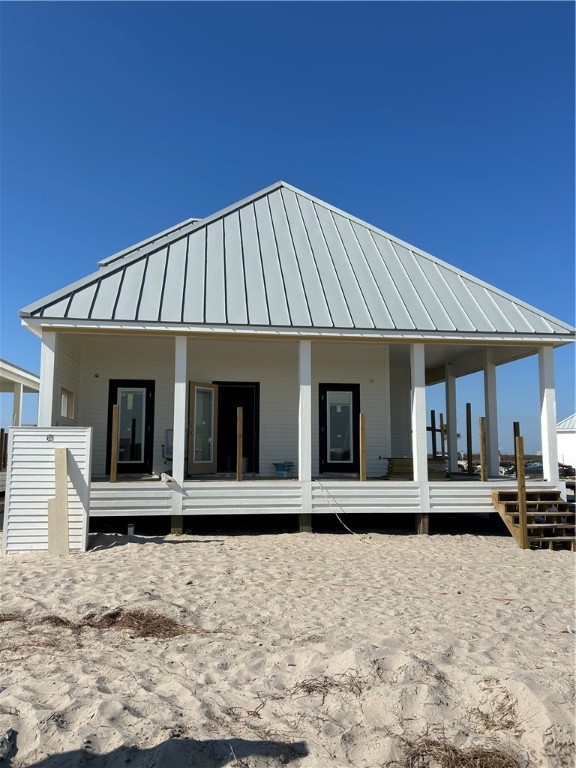 215 St John Circle Port Aransas, TX 78373 - Photo 1 of 21 a front view of a house with a yard