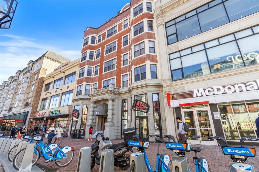 534 Commonwealth Avenue, Unit 3A Boston, MA 02215 - Photo 15 of 18 a front view of multi story building with retail shops
