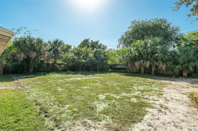 a backyard of a house with lots of green space