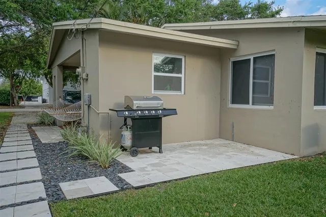 a backyard of a house with seating space