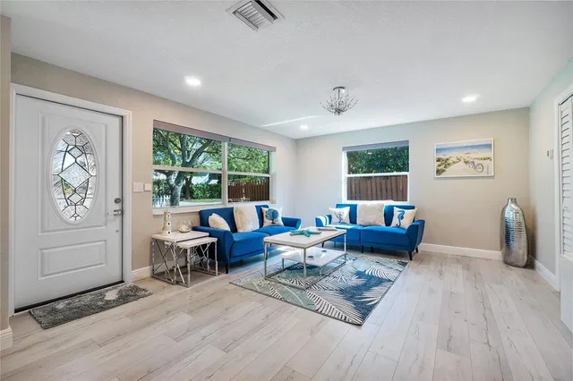 a living room with furniture and a window