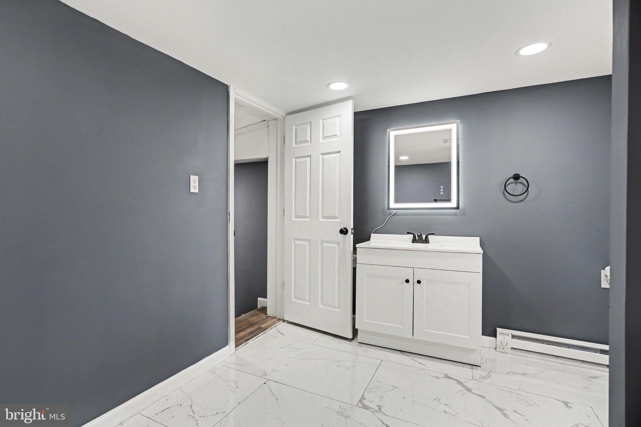 1041 Rohlers Church Road Dover, PA 17315 - Photo 12 of 33 Sleek modern bathroom with elegant tiles.