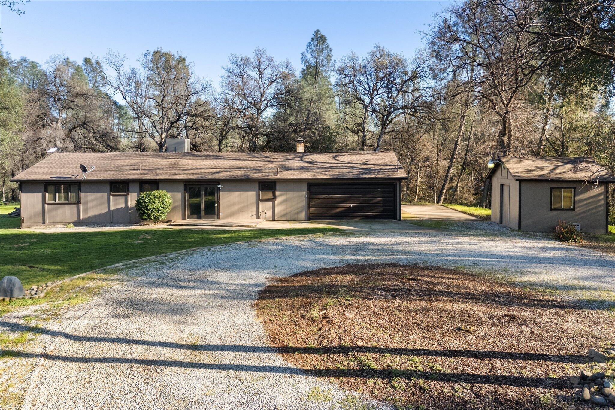 8003 Narrows Way Redding, CA 96001 - Photo 1 of 40 a front view of a house with a yard