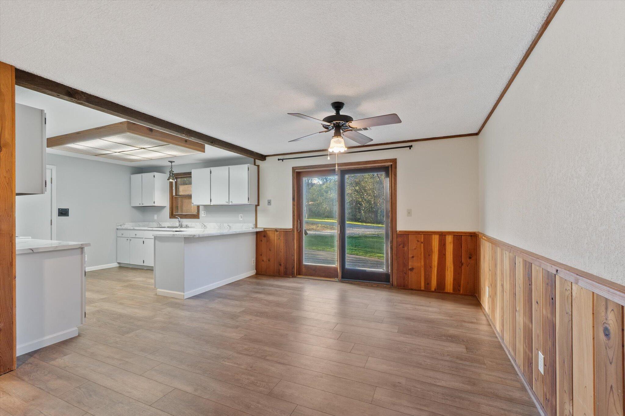 8003 Narrows Way Redding, CA 96001 - Photo 17 of 40 a large white kitchen with a large window stainless steel appliances and cabinets