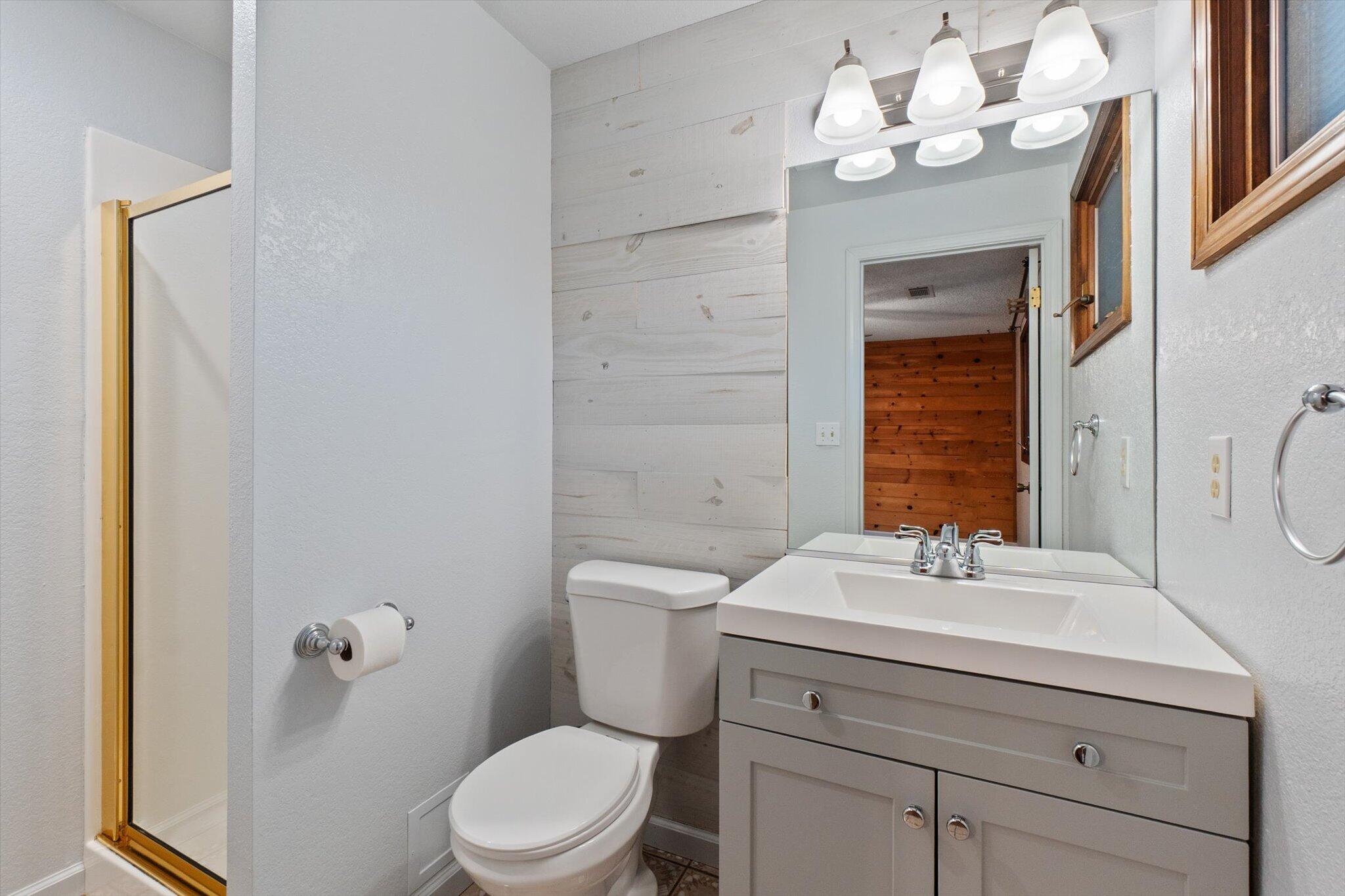 8003 Narrows Way Redding, CA 96001 - Photo 23 of 40 a bathroom with a sink vanity mirror and toilet