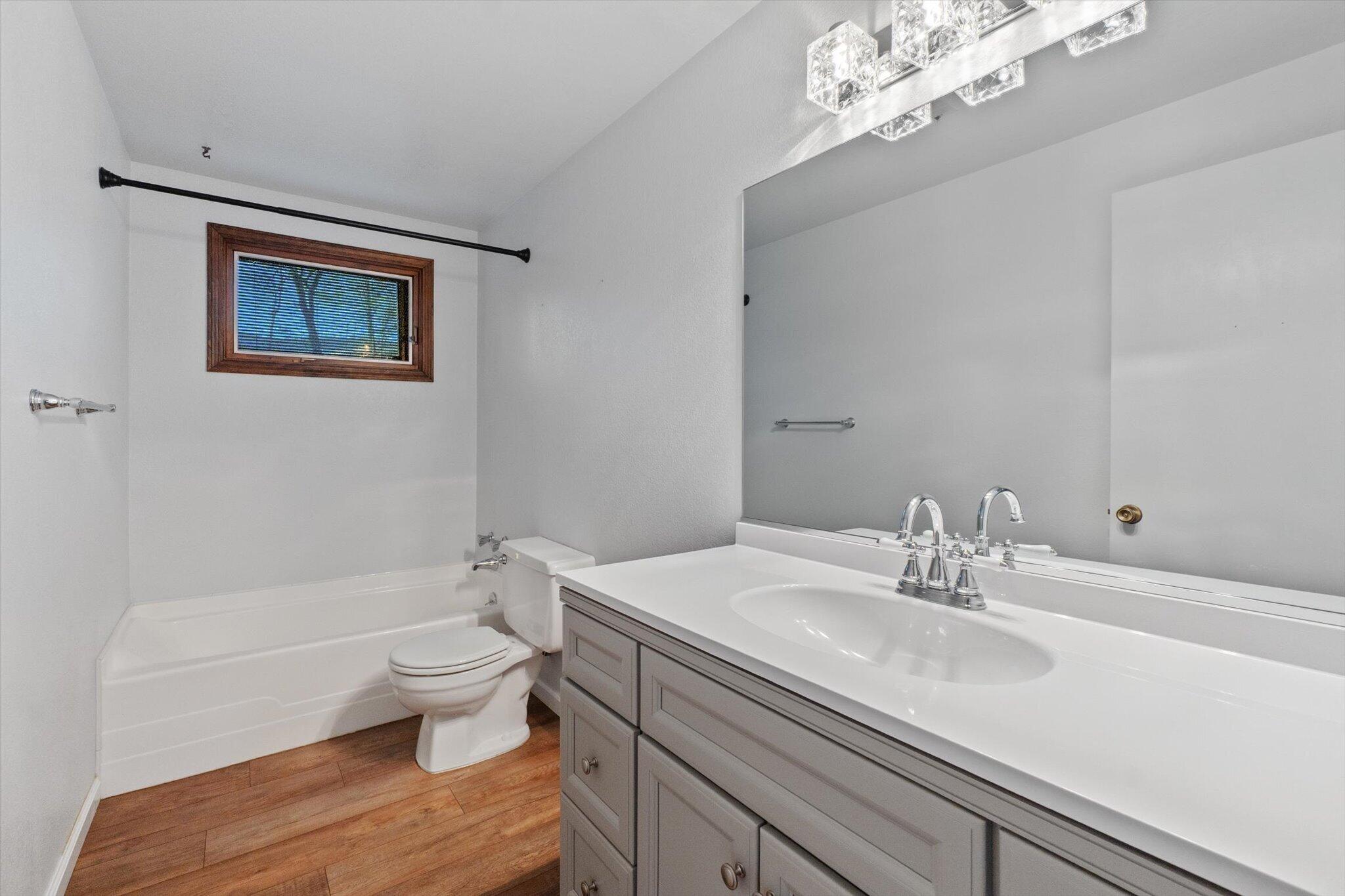 8003 Narrows Way Redding, CA 96001 - Photo 25 of 40 a bathroom with a sink a toilet and a bathtub