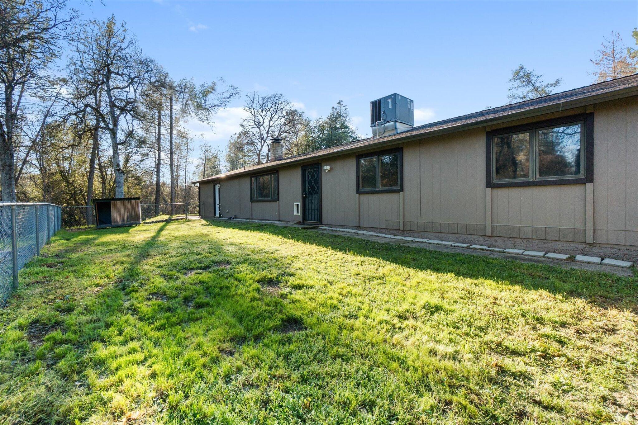 8003 Narrows Way Redding, CA 96001 - Photo 29 of 40 a view of a house with a yard