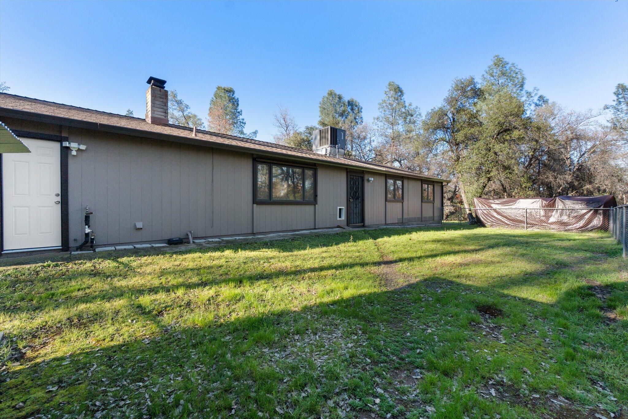 8003 Narrows Way Redding, CA 96001 - Photo 30 of 40 a house view with a garden space