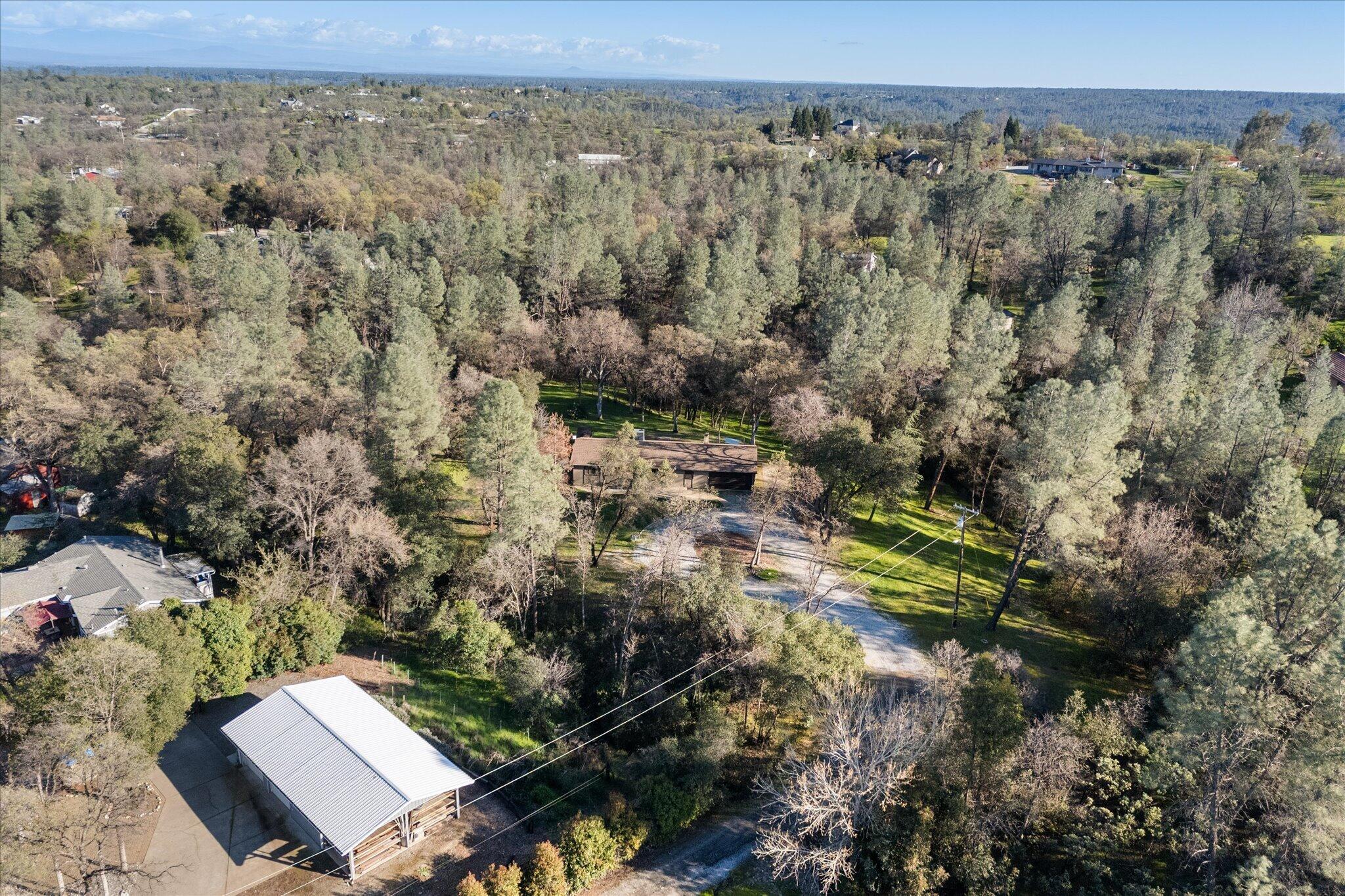 8003 Narrows Way Redding, CA 96001 - Photo 39 of 40 a view of a yard with wooden fence