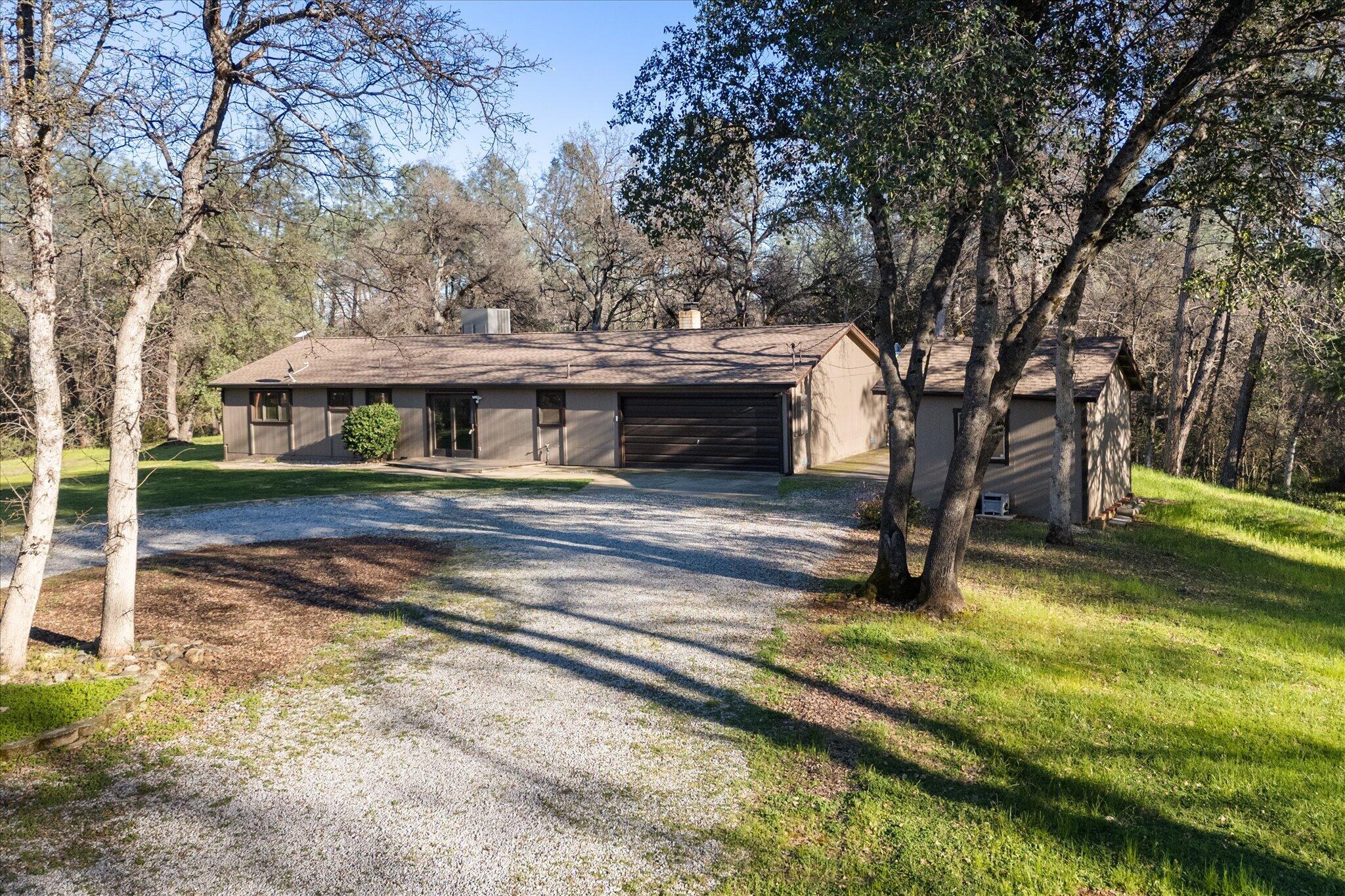 8003 Narrows Way Redding, CA 96001 - Photo 4 of 40 a view of a house with a yard balcony and tree