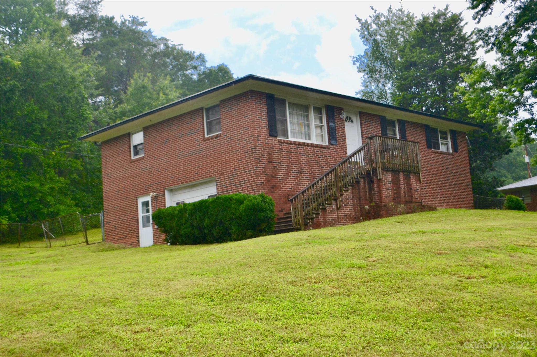 253 Green Acres Road Mooresboro, NC 28114 - Photo 3 of 20 a backyard of a house with lots of green space