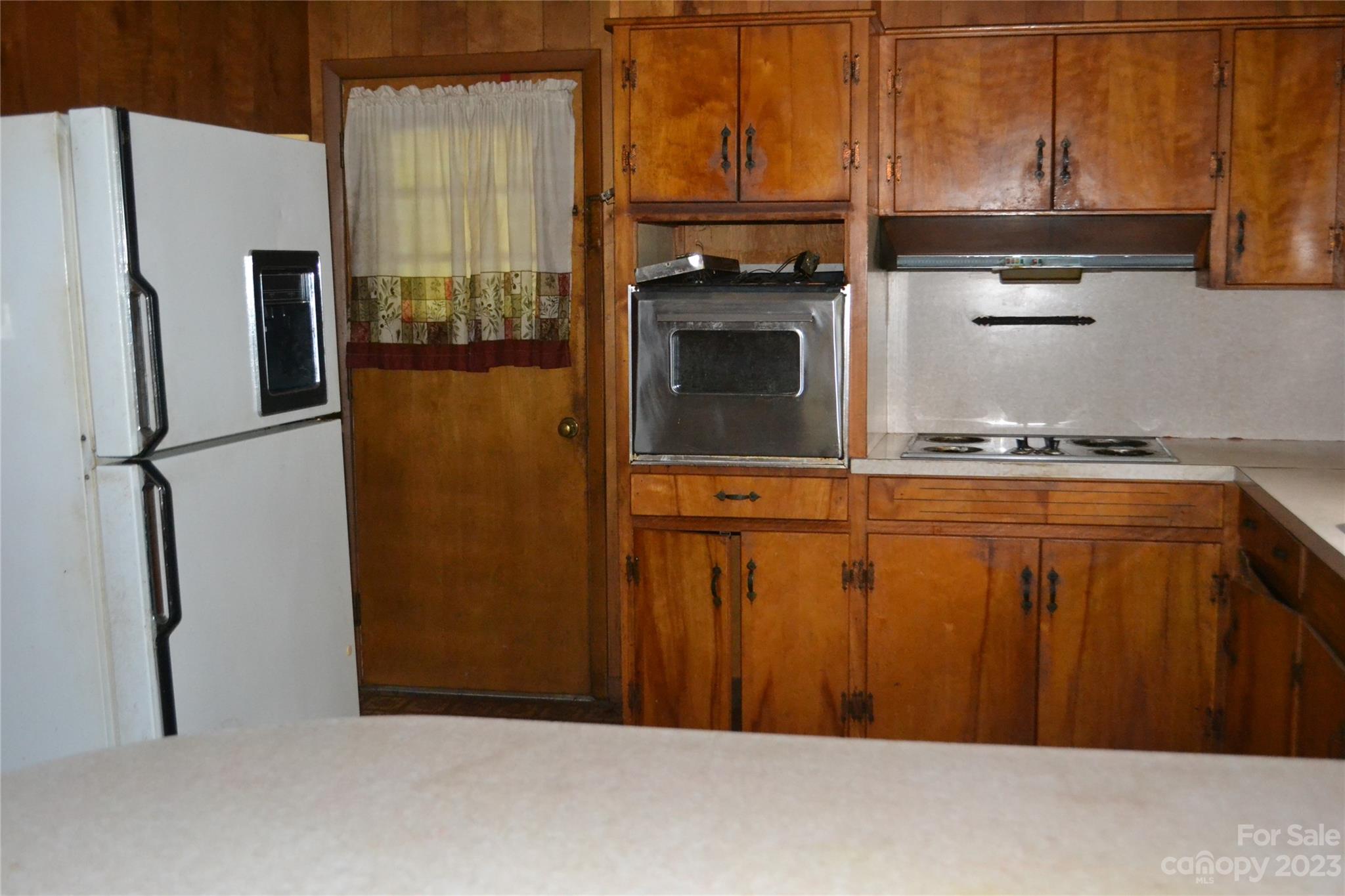 253 Green Acres Road Mooresboro, NC 28114 - Photo 8 of 20 a kitchen with stainless steel appliances a refrigerator and a stove