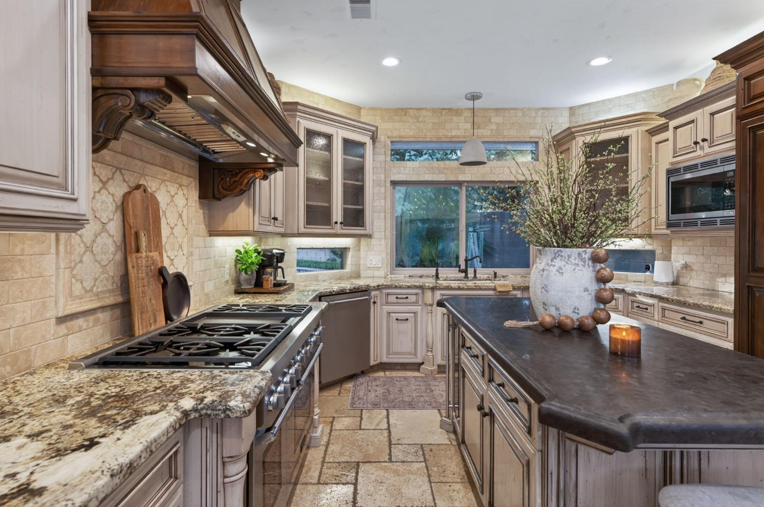 601 Decatur Avenue Clovis, CA 93611 - Photo 15 of 62 a kitchen with stainless steel appliances granite countertop a sink stove and cabinets