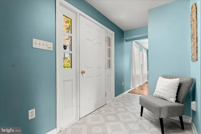 a bedroom with a bed and a chair