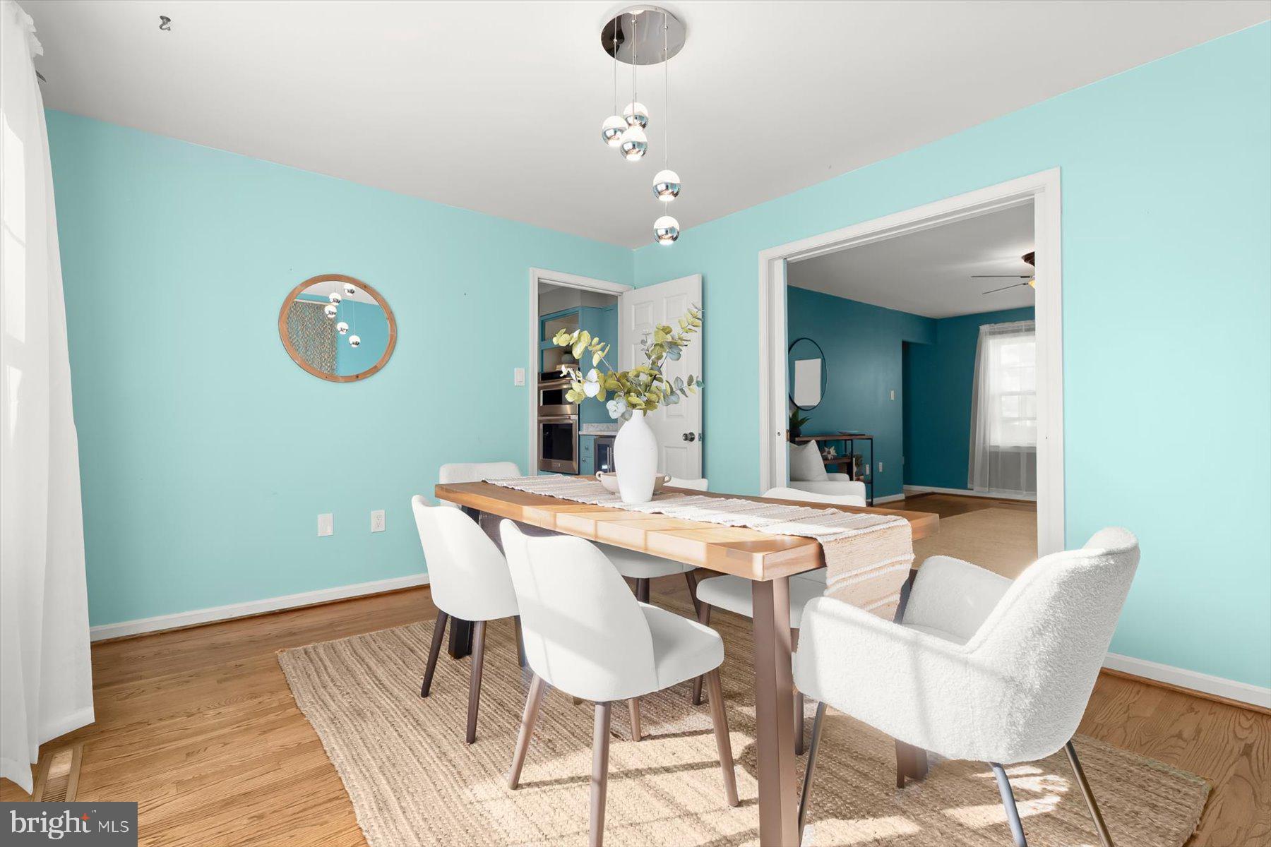 9600 Watkins Road Gaithersburg, MD 20882 - Photo 17 of 47 a view of a dining room with furniture and wooden floor