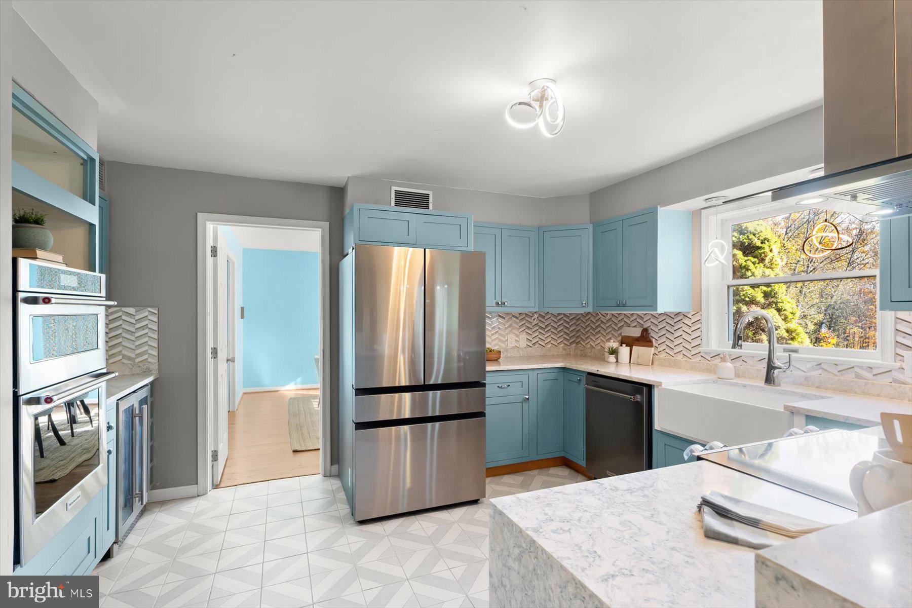 9600 Watkins Road Gaithersburg, MD 20882 - Photo 19 of 47 a kitchen with a refrigerator sink and stove