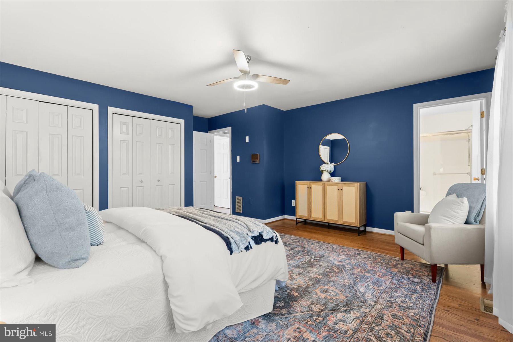 9600 Watkins Road Gaithersburg, MD 20882 - Photo 26 of 47 a spacious bedroom with a bed and a chandelier