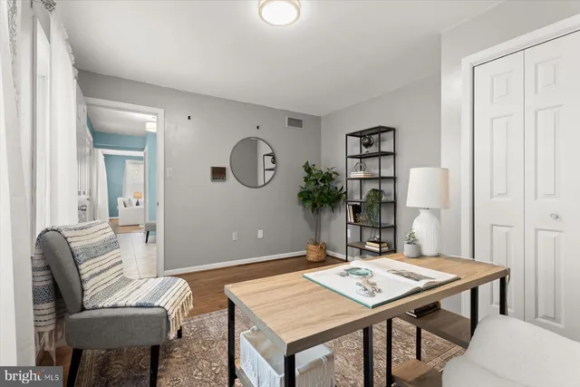 a living room with a table and chairs