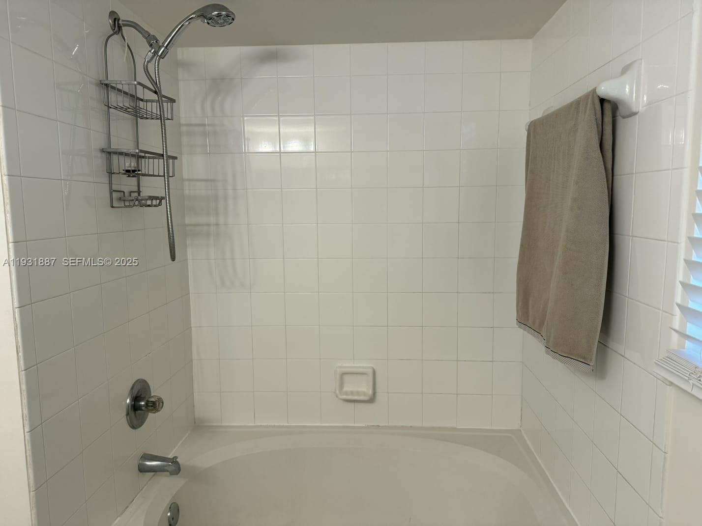 11145 Southwest 6th Street, Unit 104 Pembroke Pines, FL 33025 - Photo 11 of 37 a bathroom with a shower