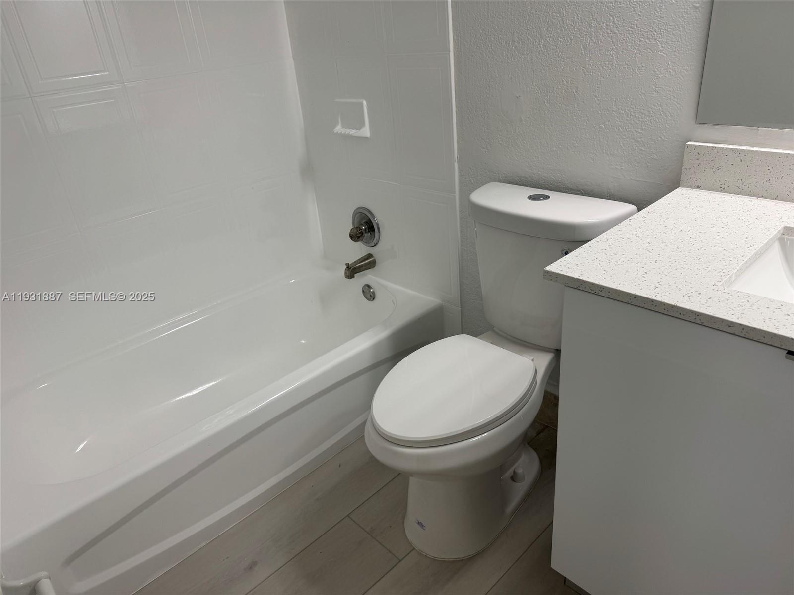11145 Southwest 6th Street, Unit 104 Pembroke Pines, FL 33025 - Photo 14 of 37 a bathroom with a sink and a toilet