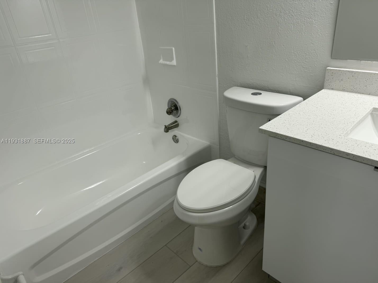 11145 Southwest 6th Street, Unit 104 Pembroke Pines, FL 33025 - Photo 19 of 37 a bathroom with a sink and a toilet