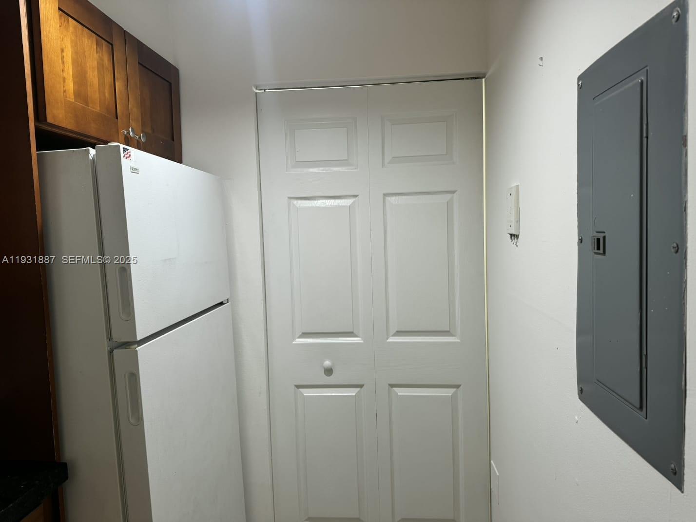 11145 Southwest 6th Street, Unit 104 Pembroke Pines, FL 33025 - Photo 2 of 37 a white refrigerator freezer and a refrigerator in a kitchen