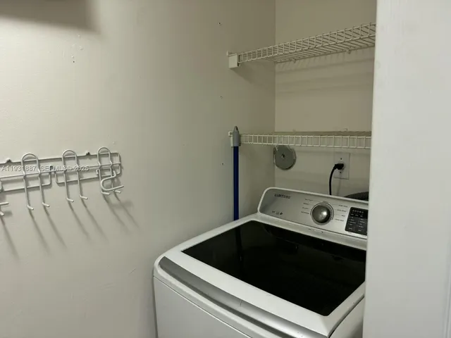 a view of a lake with a table and chairs