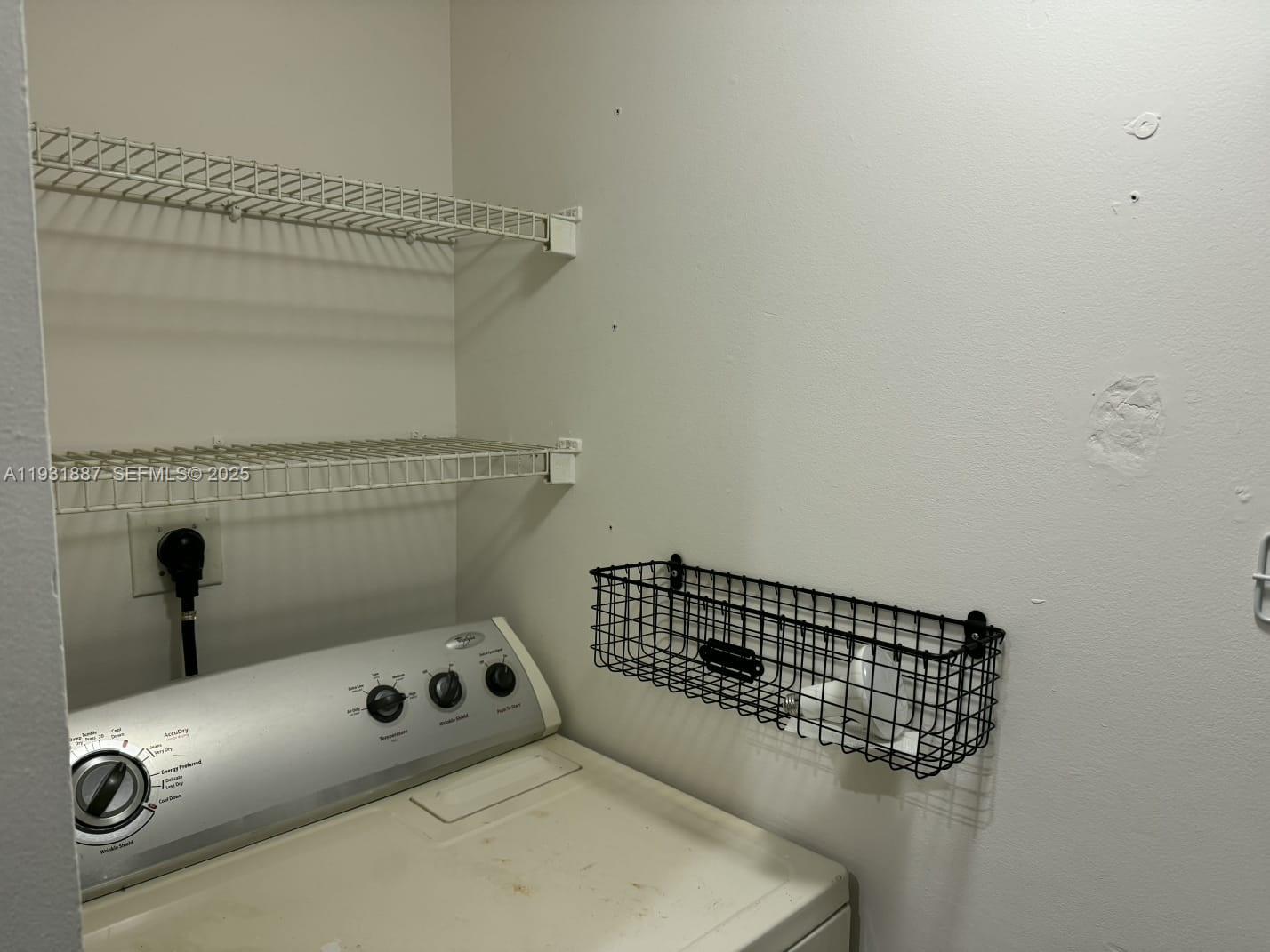 11145 Southwest 6th Street, Unit 104 Pembroke Pines, FL 33025 - Photo 23 of 37 a close view of a utility room with washer and dryer
