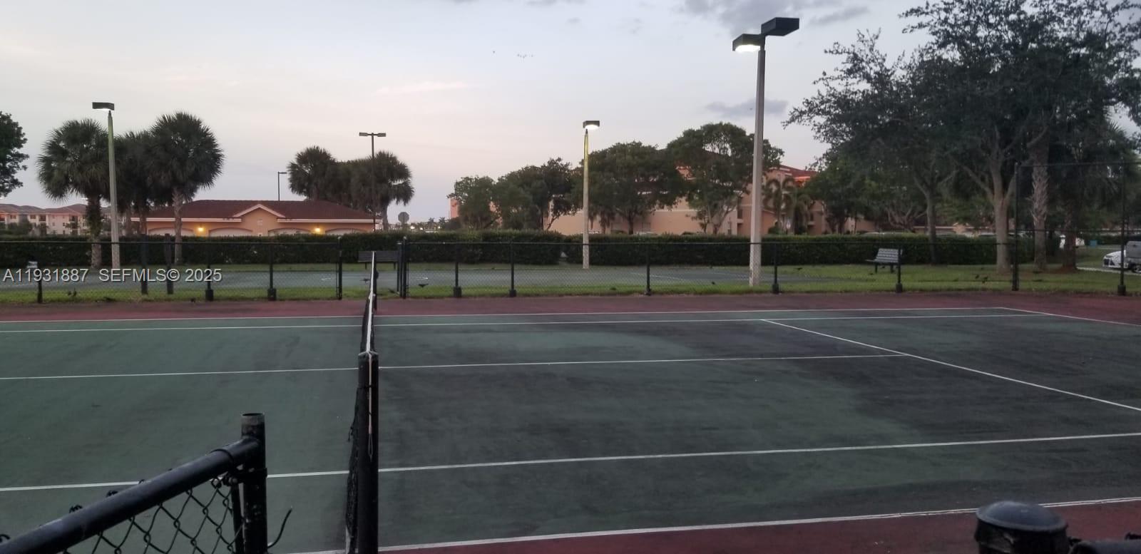 11145 Southwest 6th Street, Unit 104 Pembroke Pines, FL 33025 - Photo 30 of 37 a view of a tennis court