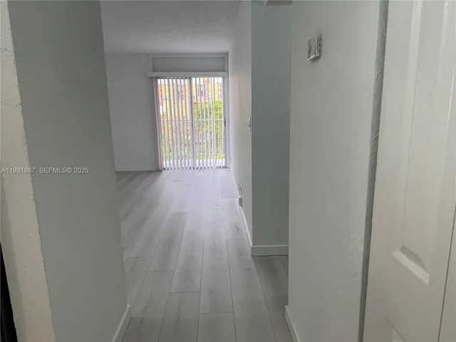 a view of a room with sliding glass door