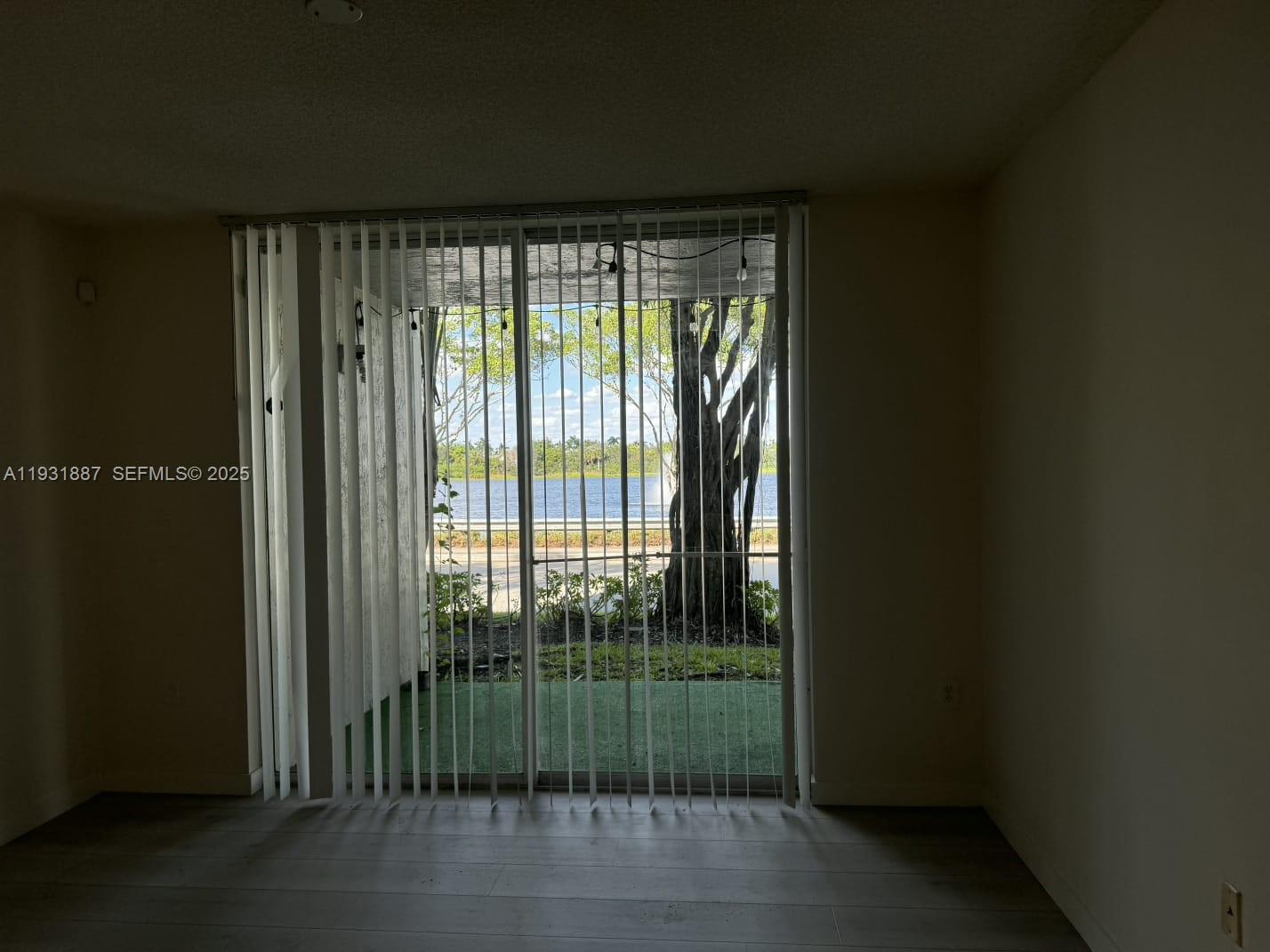 11145 Southwest 6th Street, Unit 104 Pembroke Pines, FL 33025 - Photo 9 of 37 a view of a room with sliding glass door