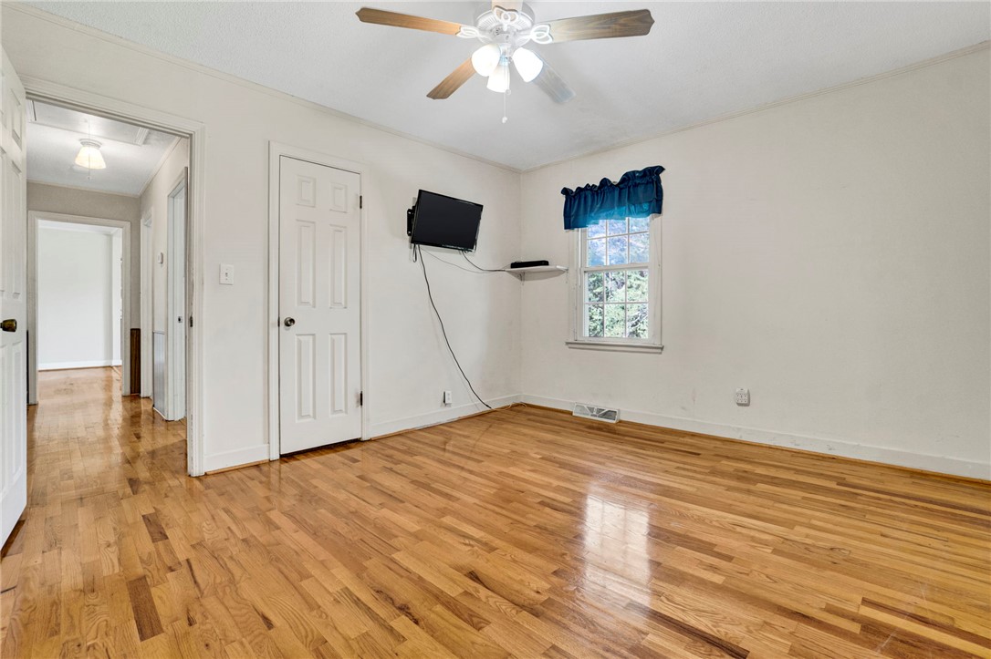 7876 Highway 11 Walhalla, SC 29691 - Photo 24 of 35 Hardwood flooring extends throughout this naturally illuminated interior space, offering versatile usage.