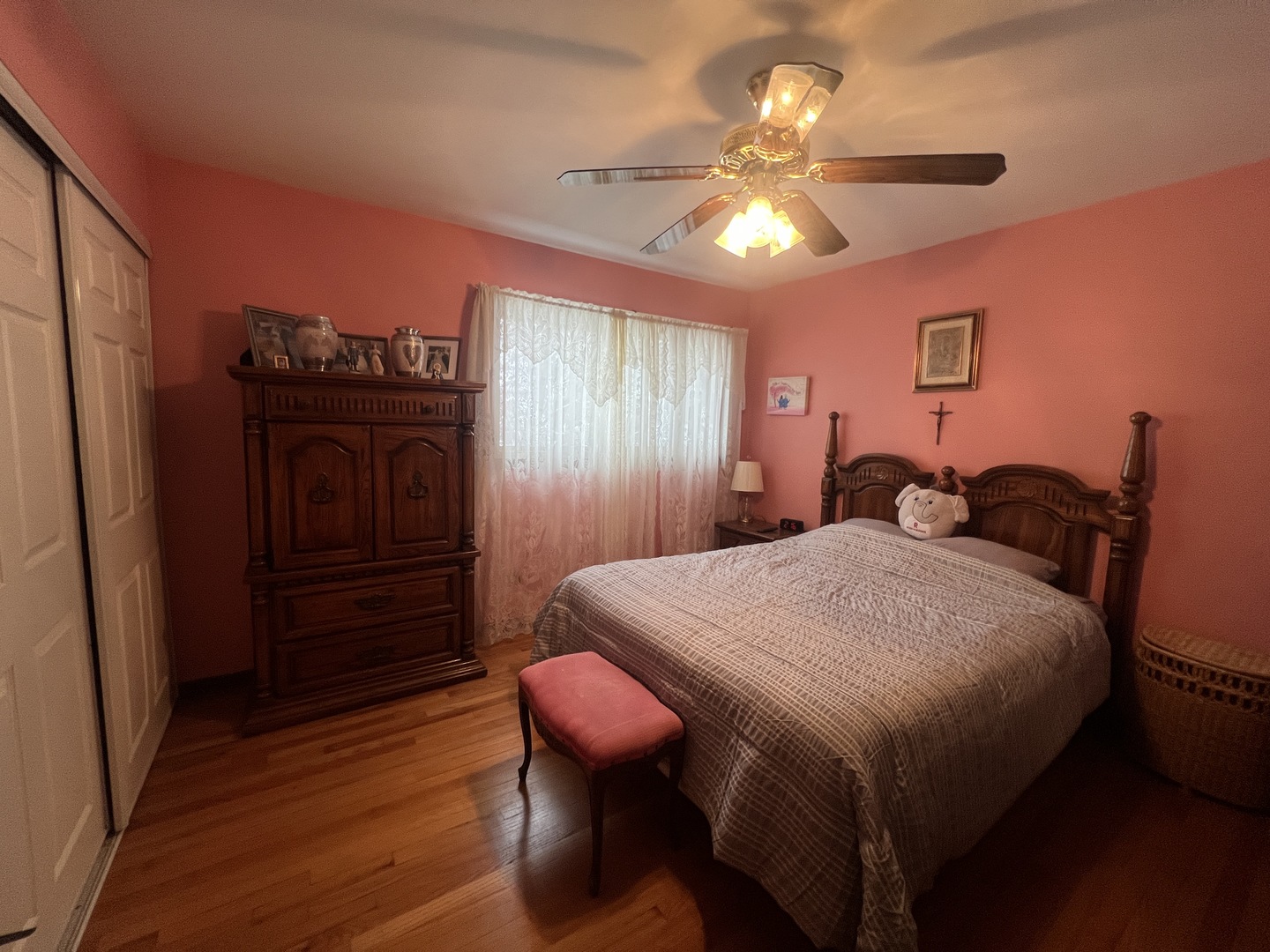 620 Willow Street Frankfort, IL 60423 - Photo 16 of 32 a bedroom with a bed and a chandelier