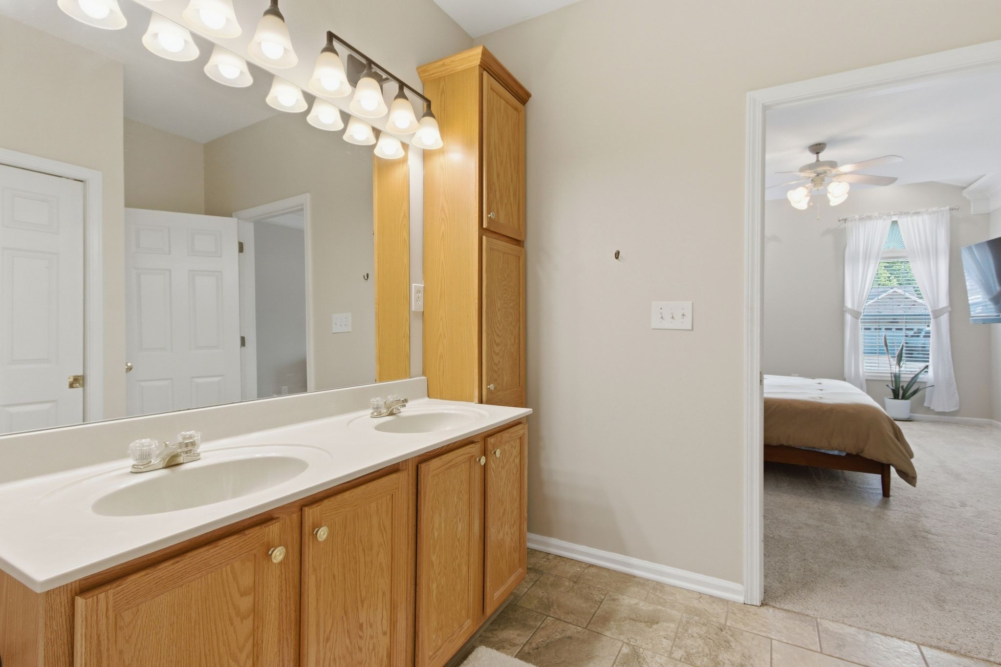 1503 Chapman Lane Spring Hill, TN 37174 - Photo 18 of 33 a en suite bathroom with a sink a large mirror and a shower