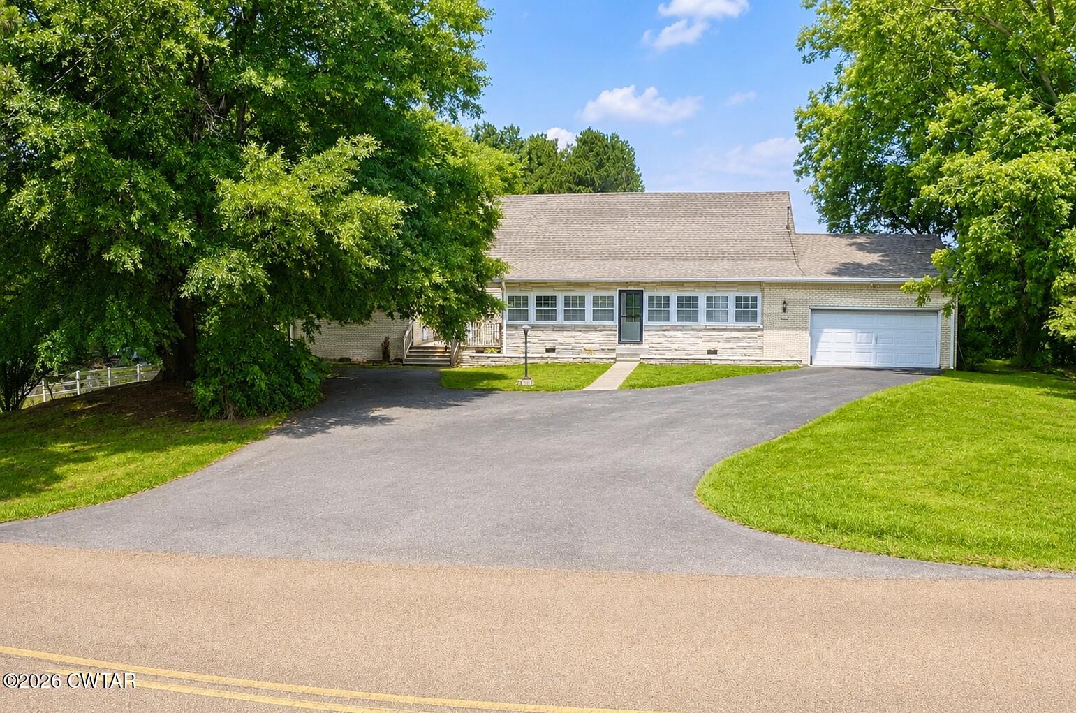 2800 Locust Grove Road Newbern, TN 38059 - Photo 1 of 46 a view of a house with a swimming pool and a yard